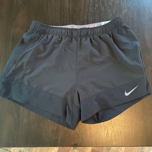 Nike athletic shorts w/ built in spandex - medium
